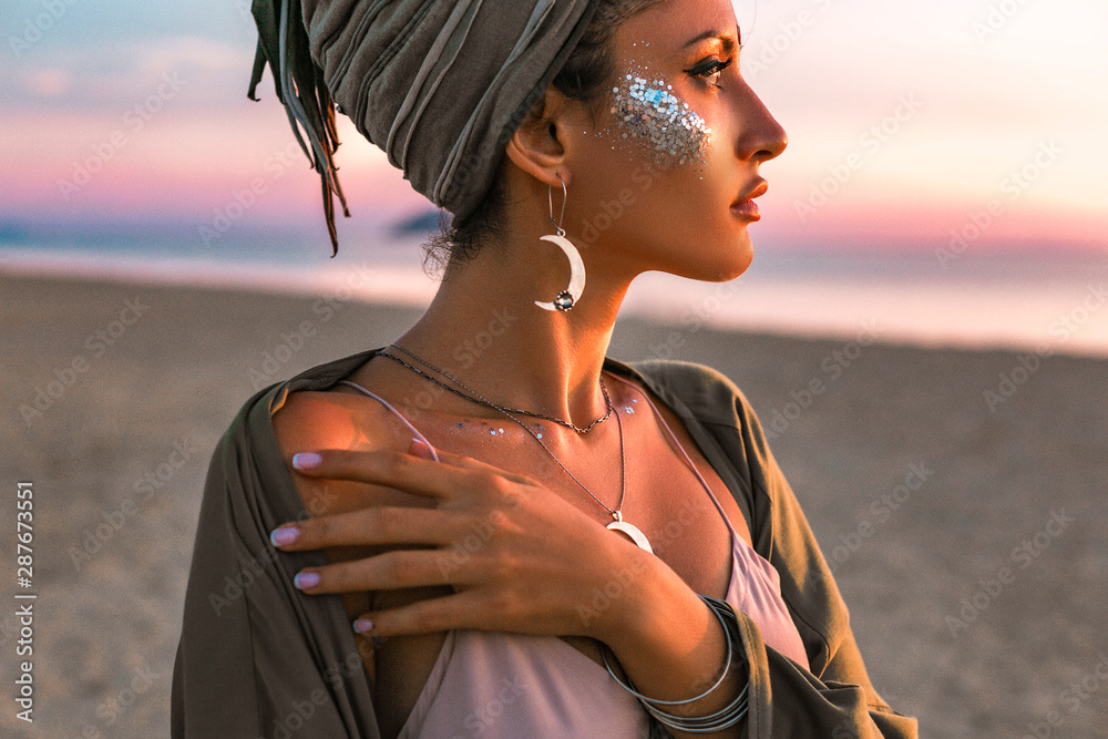beautiful young fashion model on the beach at sunset portrait - obrazy, fototapety, plakaty 