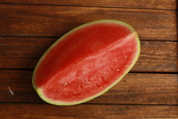 Poster - cut watermelon on wooden background