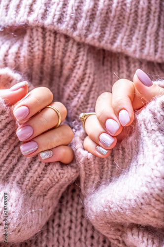 Vászonkép Art nail manicure for bride in purple sweater