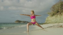 Woman Practicing Yoga On Ocean Beach / Jamesby Island, Tobago Cays, St. Vincent And The Grenadines