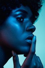 Marvelous Night. Portrait Of Female Fashion Model In Neon Light On Gradient Background. Beautiful African Woman With Trendy Make-up And Well-kept Skin. Vivid Style, Beauty, Cosmetics Concept.