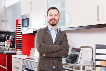 Male in kitchen furniture salon