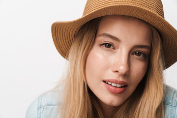 Sticker - Serious amazing young pretty woman wearing hat posing isolated over white wall background.