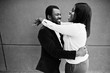 © AS Photo Family - Stylish african american couple in formal wear hugs together. Romantic couple in love dating.