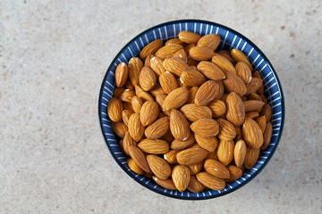 Sticker - almond nuts on granite background