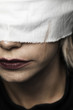 © Freepik - Close-up of blonde woman with white blindfold