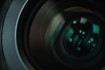 Poster - Close up beautiful camera lens with color reflection  background.