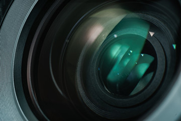 Poster - Close up beautiful camera lens with color reflection  background.