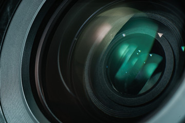 Poster - Close up beautiful camera lens with color reflection  background.