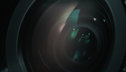 Poster - Close up beautiful camera lens with color reflection  background.