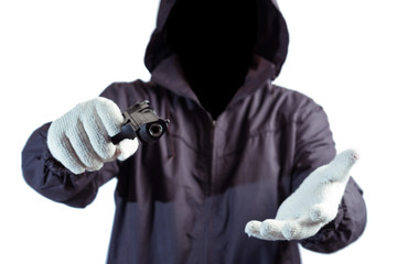 front of hacker man with dark face holding a gun in hand isolated on white background