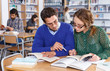 © JackF - Female and male students working in library