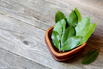 Wall Mural - Laurel or sweet bay in a wooden bowl