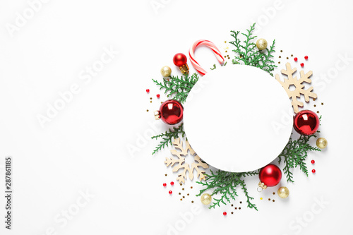 Fotomural Flat lay composition with Christmas decor and blank card on white background