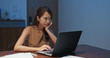 © leungchopan - Woman feeling tired on look at the laptop computer at home in the evening