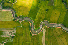 Aerial View Of Devious River In A Fields