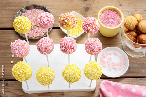 Pink And Yellow Cake Pops Stock Photo Adobe Stock Cake pops are dipped in a choice of white, milk or dark chocolate. adobe stock