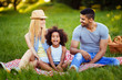 © NDABCREATIVITY - Picture of lovely couple with their daughter having picnic