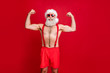 © deagreez - Portrait of nice attractive content cheerful funky glad content strong powerful cool gray-haired strong man trainer instructor bodybuilder showing muscles isolated on bright vivid shine red background