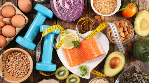 Fotomural selection of diet food, salmon with dumbbell and healthy food