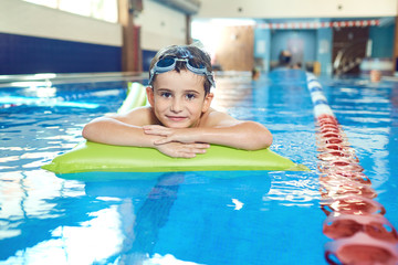 Wall Mural - The boy smiles in the swimming pool.