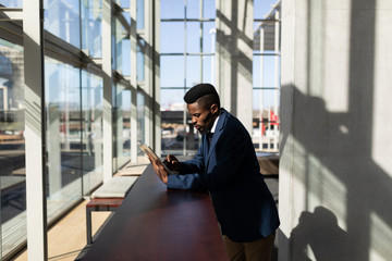 Wall Mural - African-American businessman using digital tablet in office