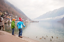 Children, Feeding Ducks In Lake In Austrian Hallstadt, Scenery View