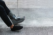 A Asian girl is wearing a ankle support boot after surgery.