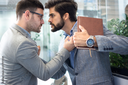 Fotografía Business conflict between two business men in formal-wear in office