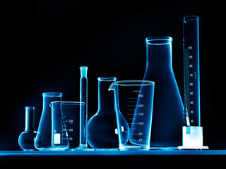 Wall Mural - different laboratory glassware with liquid and with reflection