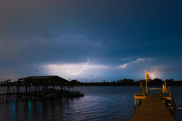 Lightning striking over a lake