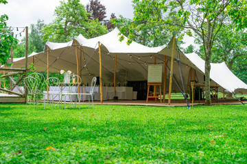 Image of huge tent for a wedding event in the nature