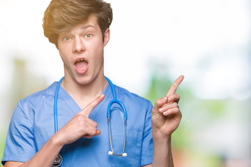 Wall Mural - Young doctor wearing medical uniform over isolated background smiling and looking at the camera pointing with two hands and fingers to the side.