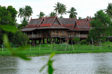 Wall Mural - A slick vintage waterfront house in Thai style