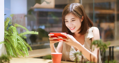 Sticker - Young woman play mobile game