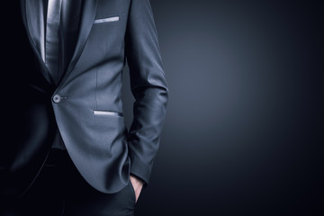 business man in a suit on a gray background