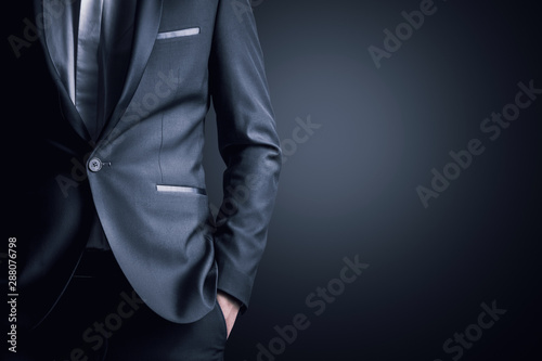 Fotografía Business man in a suit on a gray background