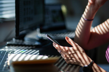 woman hands using smartphone, home office background, social media  influencer