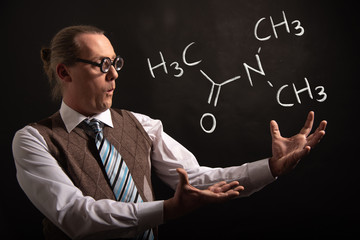 Poster - Professor presenting handdrawn chemical formula of Dimethylacetamide