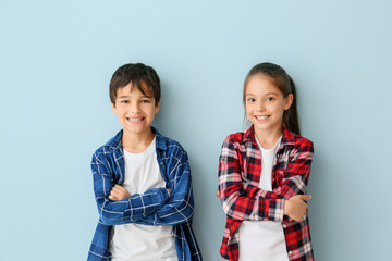 Wall Mural - Portrait of cute children on color background