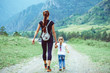 © venerala - mother and daughter are among the mountains