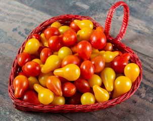 Canvas Print - cherry tomatoes red and yellow on wooden background