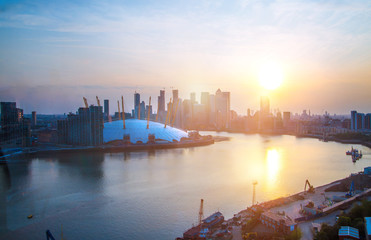 Sticker -  London at sunset. View includes Canary Wharf business and banking complex, docks, London arena and river Thames.