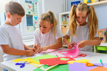 Wall Mural - Mother with children. Creative arts and crafts project at school or at home.