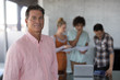 © WavebreakMediaMicro - Male executive standing in office