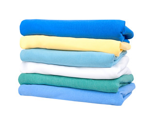 Wall Mural - Stack of cotton clothes isolated.Folded clean colorful clothing on white.