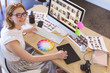 © WavebreakMediaMicro - Female graphic designer working on graphic tablet at desk in office