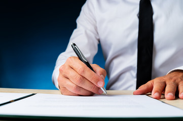 Wall Mural - Business manager signing a document