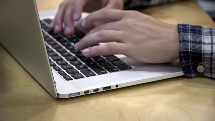 Poster - working on laptop computer. freelancer's hands typing on laptop keyboard text. business concept.hand