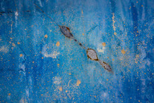Blue And Orange Background With Ink Texture On Metal. Blue Colored Abstract.